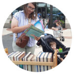 A family browses books at a community event.