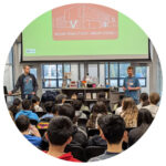 staff talk to students about getting a library card.
