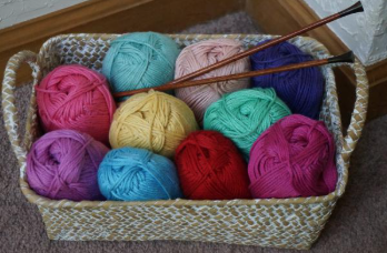 A basket full of colorful yarn.